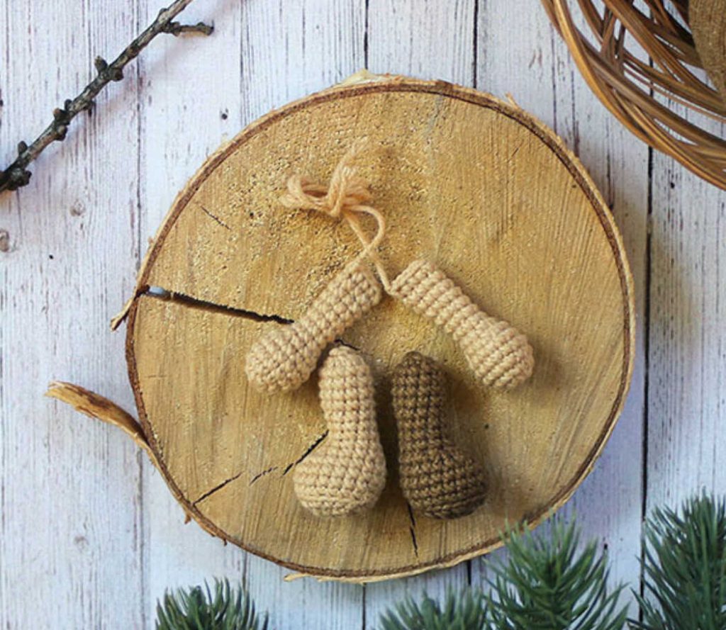 Crochet puppy legs and arms pieces on wooden surface, amigurumi dog parts for free crochet pattern