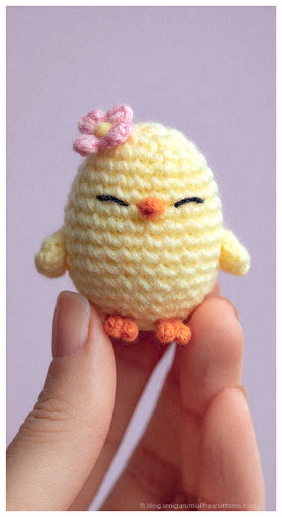 Tiny amigurumi chick crochet toy held between fingers, cute handmade chick gift